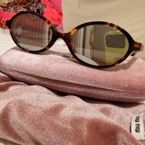 Miu Miu Miu Regard with mirrored lenses  Sunglasses with the Velvet Pink Case